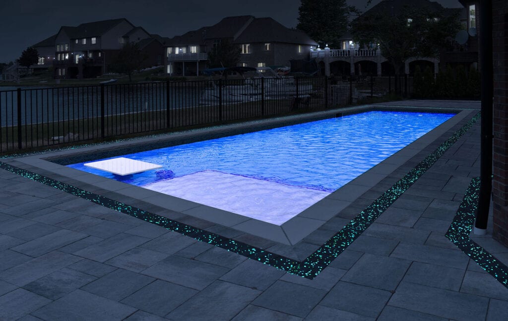 Swimming pool rendering showing off GlowPath Pavers at night